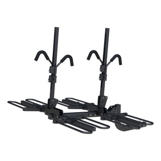 CURT Tray-Style Hitch-Mounted Bike Rack for Secure Transport CURT tray-style bike rack with hitch-mount, holding four bikes securely.