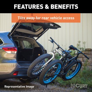 CURT Tray-Style Hitch-Mounted Bike Rack for Secure Transport CURT tray-style bike rack with hitch-mount, holding four bikes securely.
