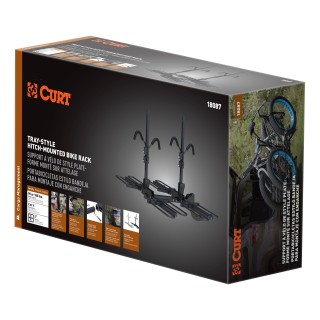 CURT Tray-Style Hitch-Mounted Bike Rack for Secure Transport CURT tray-style bike rack with hitch-mount, holding four bikes securely.
