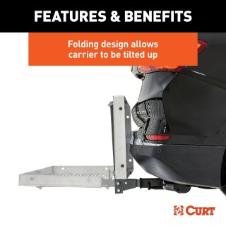CURT Aluminum Hitch-Mounted Folding Cargo Carrier 500 lbs Capacity CURT tray-style hitch-mounted cargo carrier with aluminum design, folding feature, and 500 lbs capacity mounted on a vehicle.