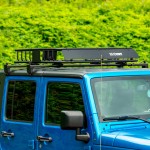 CURT Jeep Roof Rack Crossbars for Wrangler JL and Gladiator CURT Jeep roof rack crossbars mounted on a Jeep Wrangler JL or Gladiator, offering enhanced cargo storage.