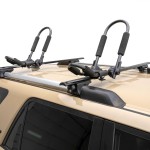 CURT Kayak Roof Rack with Rotating Arms and Foam Padding CURT kayak roof rack with adjustable arms and foam padding on vehicle roof