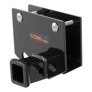CURT RV Hitch for Reliable Towing and Extra Cargo Space CURT RV hitch mounted on a vehicle, showcasing robust design and 2-inch receiver.