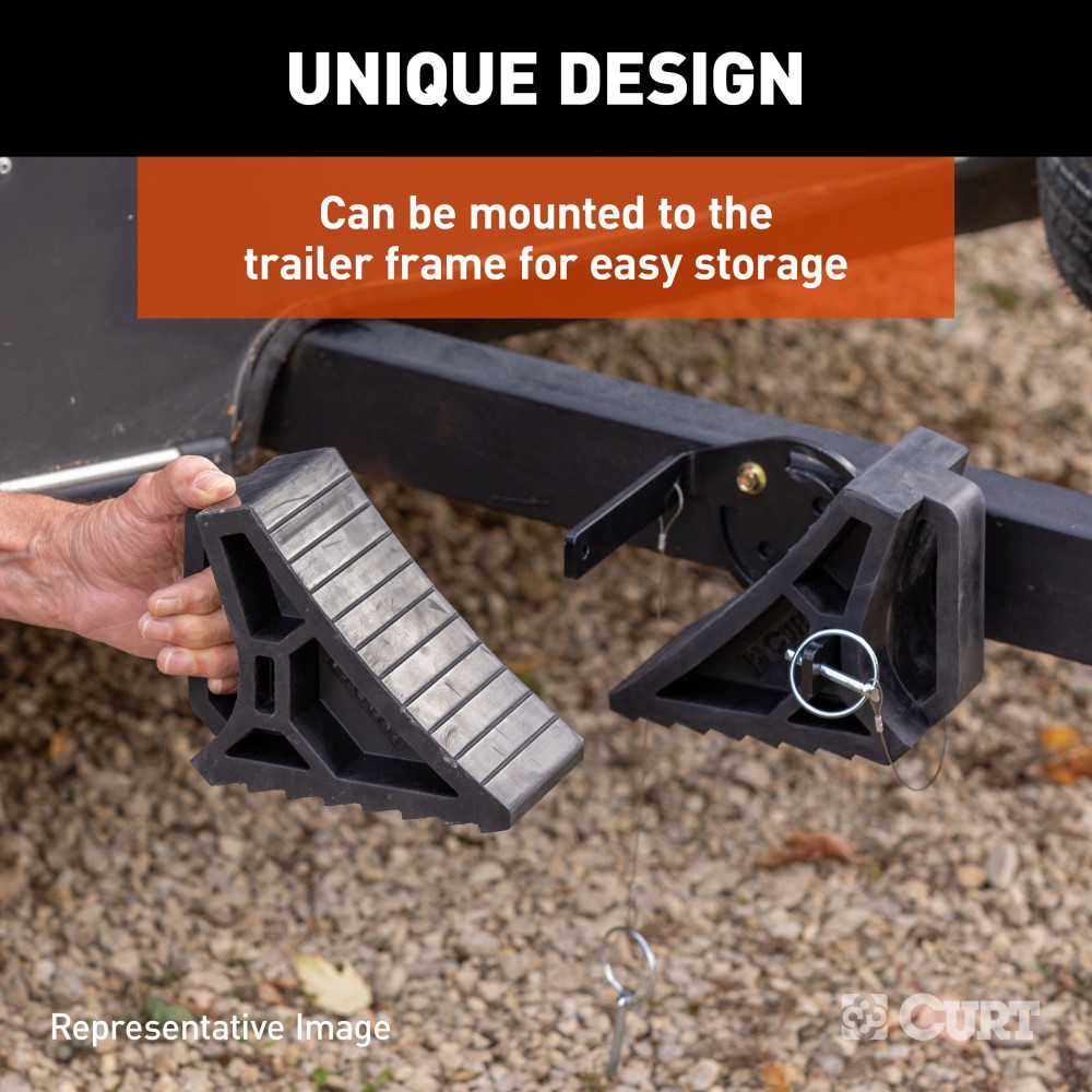 CURT HD Wheel Chocks - Heavy Duty, Space-Saving Safety Accessory Heavy-duty CURT HD wheel chocks with rubber construction for trailer safety and storage.