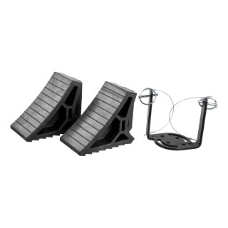 CURT HD Wheel Chocks with Mounting Bracket for Trailers CURT HD wheel chocks mounted on trailer frame with orange finish