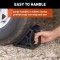 CURT HD Wheel Chocks with Mounting Bracket for Trailers CURT HD wheel chocks mounted on trailer frame with orange finish
