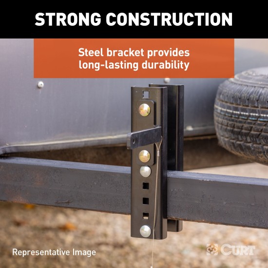 CURT HD Wheel Chocks with Mounting Bracket for Easy Storage CURT HD wheel chocks with mounting bracket attached to trailer, shown in use.