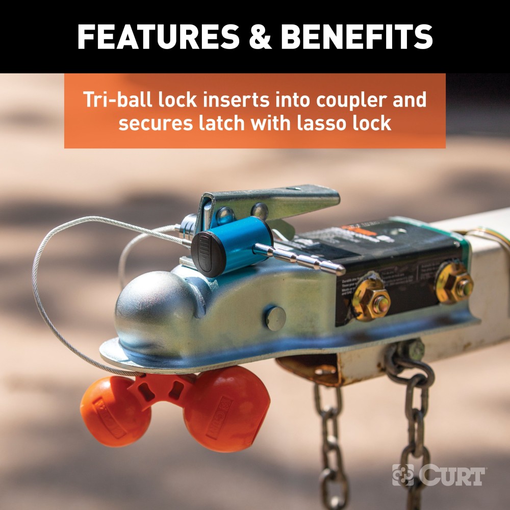 CURT tri-ball universal coupler lock in orange, securely attached to a trailer hitch