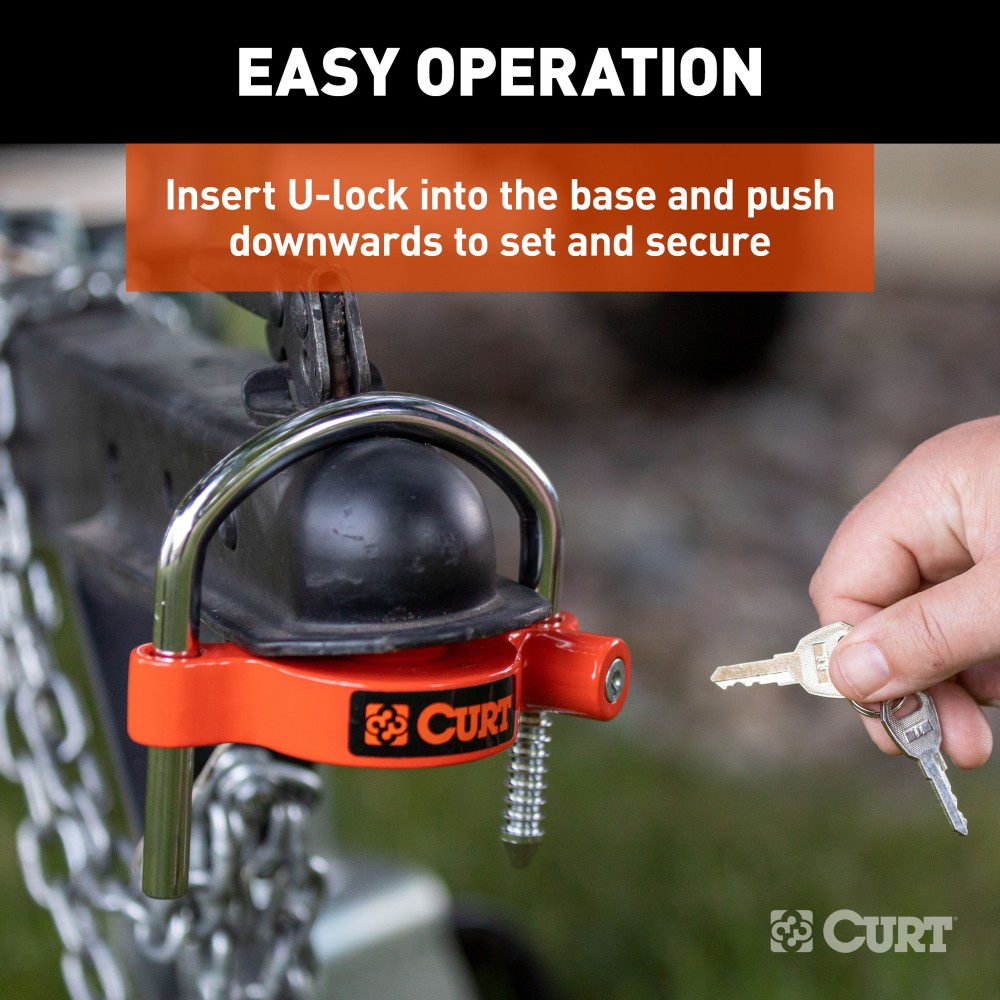 CURT Hitch and Universal Trailer Coupler Lock Set with Orange Finish CURT hitch and coupler lock set in bright orange, showcasing universal compatibility and theft-deterrent features.