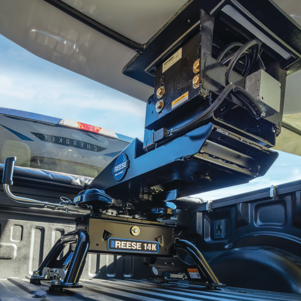 REESE 14K M5 Max Duty 5th Wheel Hitch installed on a truck for towing