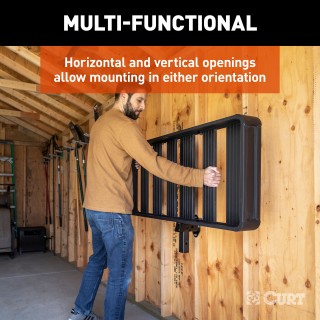 CURT wall mount organizing hitch accessories in a garage