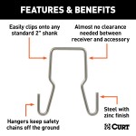 CURT Trailer Safety Chain Hanger Bracket on 2-Inch Hitch CURT safety chain hanger bracket clipped onto a 2-inch hitch shank, keeping trailer chains off the ground with durable steel construction.