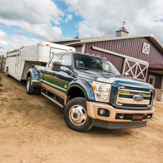 CURT Folding Ball Gooseneck Hitch with Innovative Design CURT folding ball gooseneck hitch installed on truck, showcasing fold-down design and chrome-plated ball.
