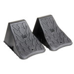 High Impact Polymer Trailer Wheel Chocks for Stability A pair of high impact polymer wheel chocks placed under trailer tires.