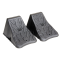 High Impact Polymer Trailer Wheel Chocks for Stability A pair of high impact polymer wheel chocks placed under trailer tires.