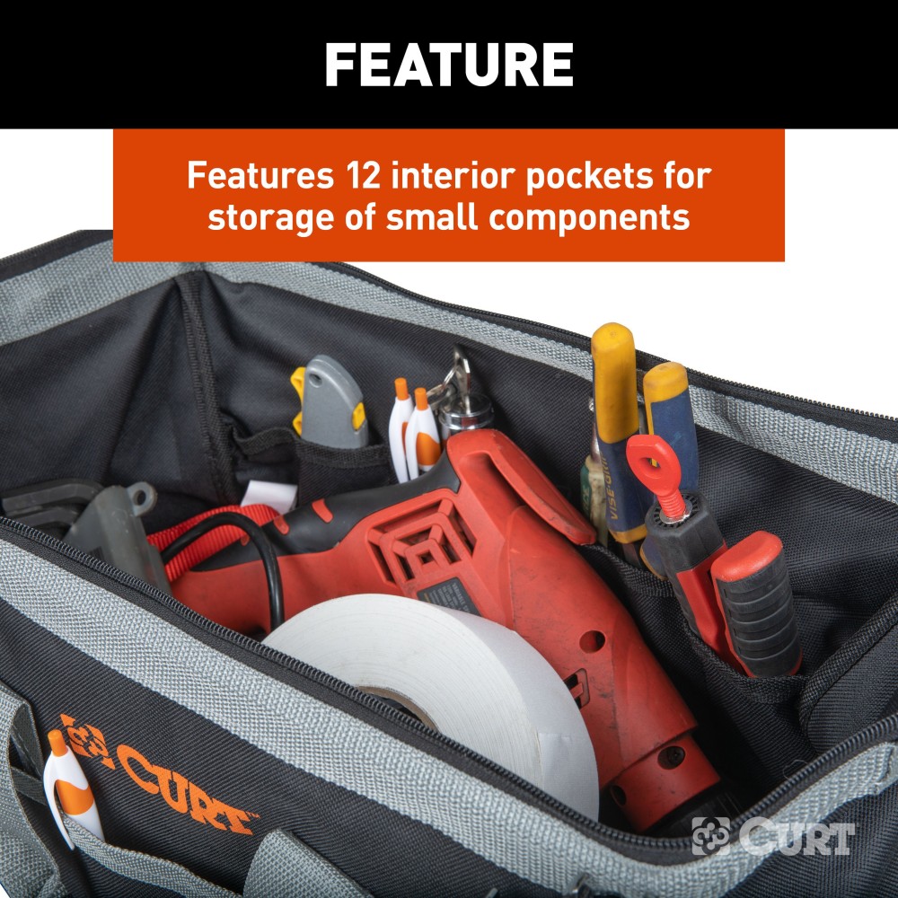A CURT tool bag featuring multiple pockets for organized towing accessories storage, comfort-grip handles, and reinforced straps.
