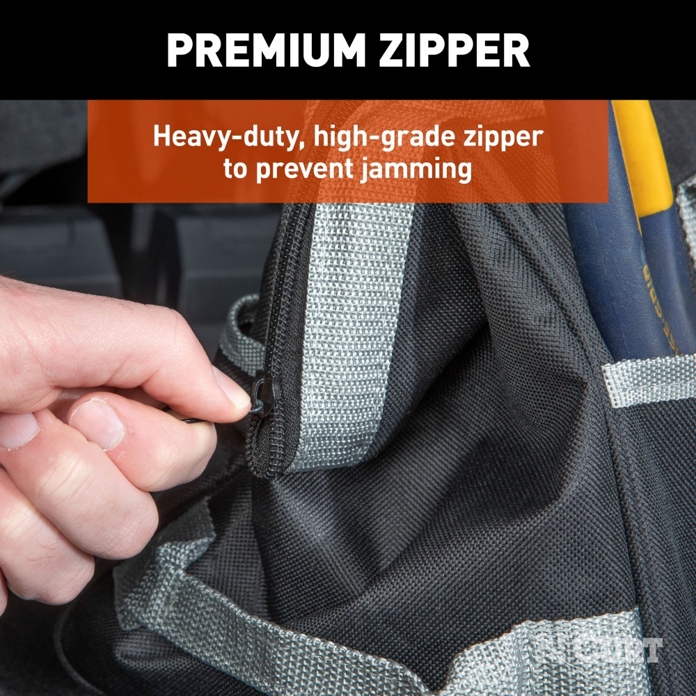 A CURT tool bag featuring multiple pockets for organized towing accessories storage, comfort-grip handles, and reinforced straps.