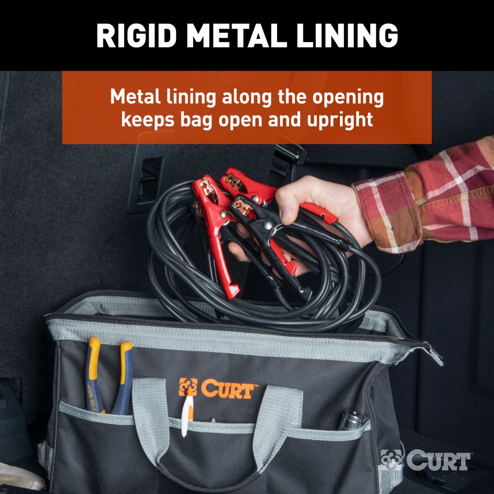 A CURT tool bag featuring multiple pockets for organized towing accessories storage, comfort-grip handles, and reinforced straps.