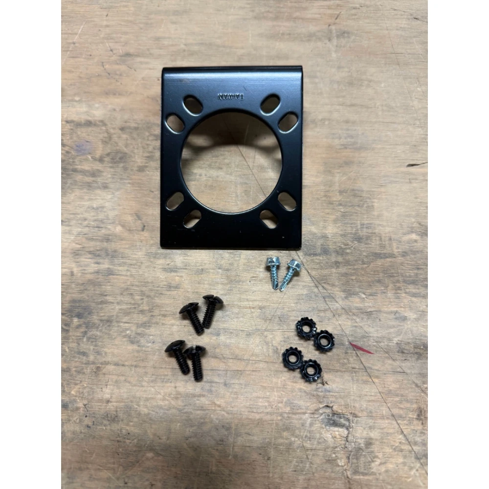 Black steel CURT electrical connector bracket securely mounts 7-way RV blade socket to trailer hitch.