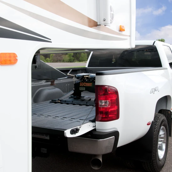 CURT adapter plate converting gooseneck hitch to 5th wheel rails, supports up to 20K lbs.