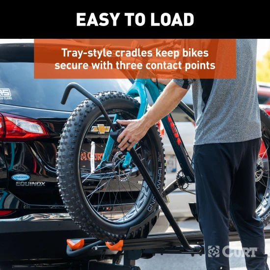CURT aluminum bike rack #18088 mounted on vehicle, holds two bikes securely.