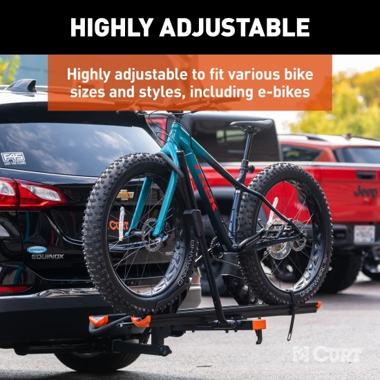 CURT aluminum bike rack #18088 mounted on vehicle, holds two bikes securely.