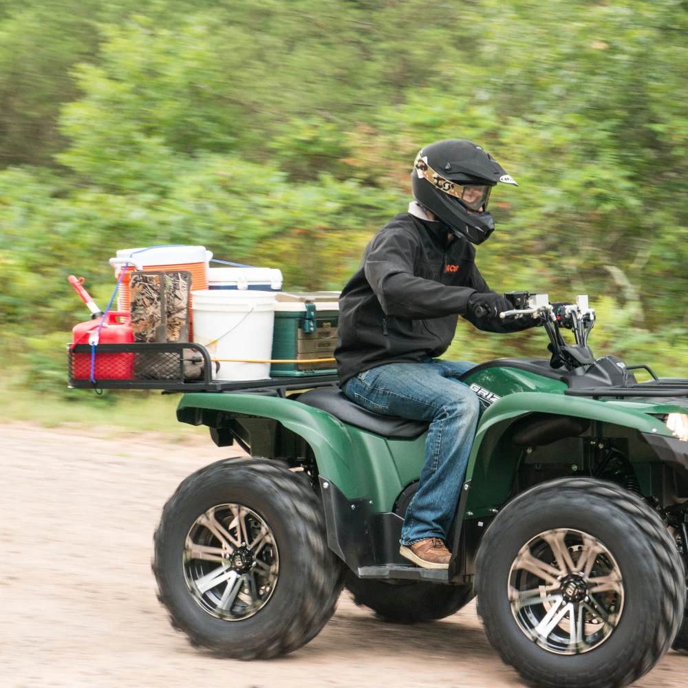 CURT ATV cargo carrier with 41x26 dimensions and 6-inch high sides for secure cargo transport