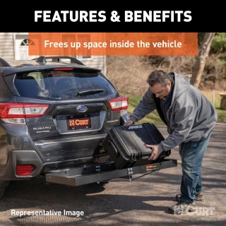 CURT trailer hitch cargo carrier, mesh tray-style, black powder coat, mounted on vehicle.