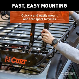 CURT quick-release bike mount attached to a roof rack holding bicycles