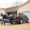 CURT hitch-mounted cargo carrier with 6-inch tall sides and durable mesh base