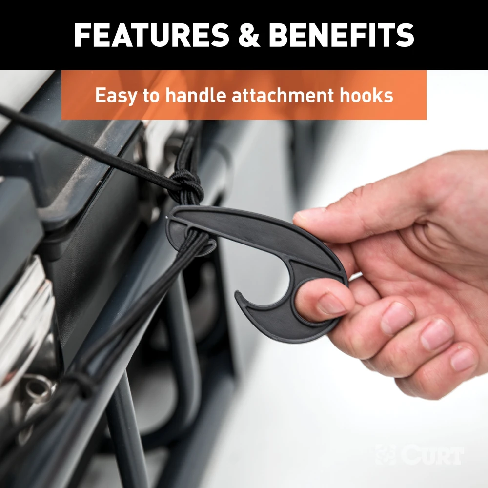 CURT cargo carrier net with hooks securing cargo on a roof rack, measuring 44 by 38 inches.