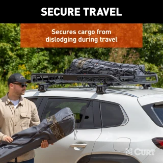 CURT cargo carrier net securely fastened over roof rack with hooks