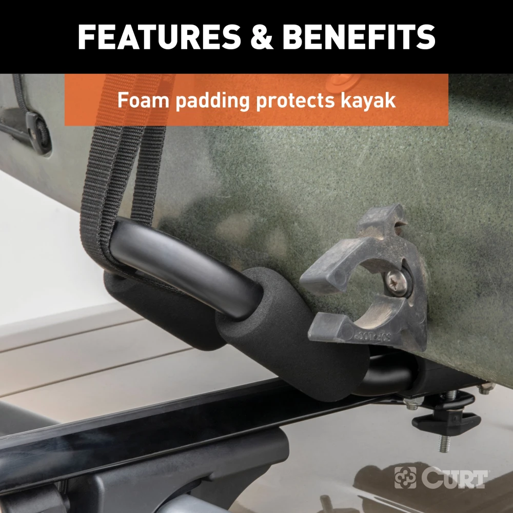 CURT kayak roof rack with adjustable arms and foam padding on vehicle roof