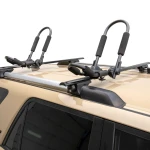 CURT kayak roof rack with adjustable arms and foam padding on vehicle roof
