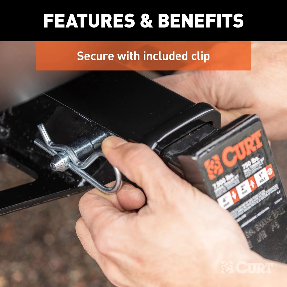 A CURT 5/8 inch hitch pin with a zinc finish and clip for secure towing