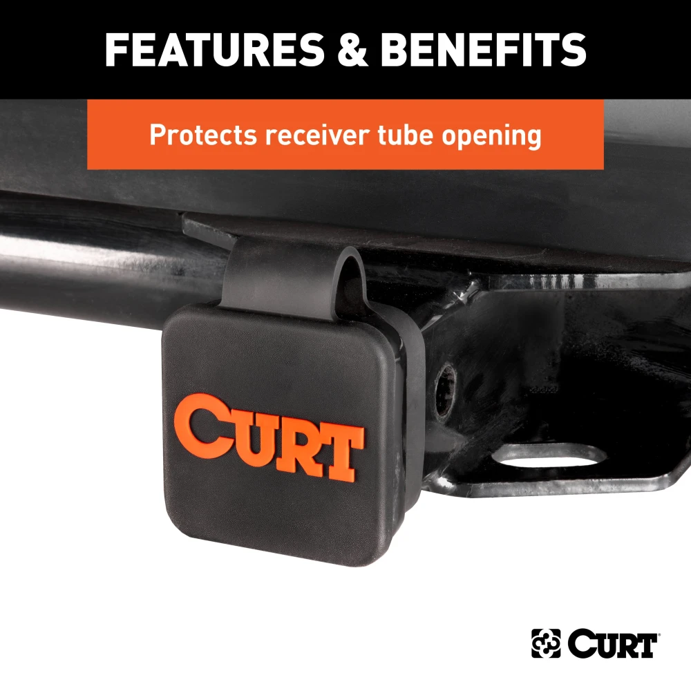 CURT trailer hitch cover made from black rubber, protects 2-inch receiver tube with orange logo and friction fit design.