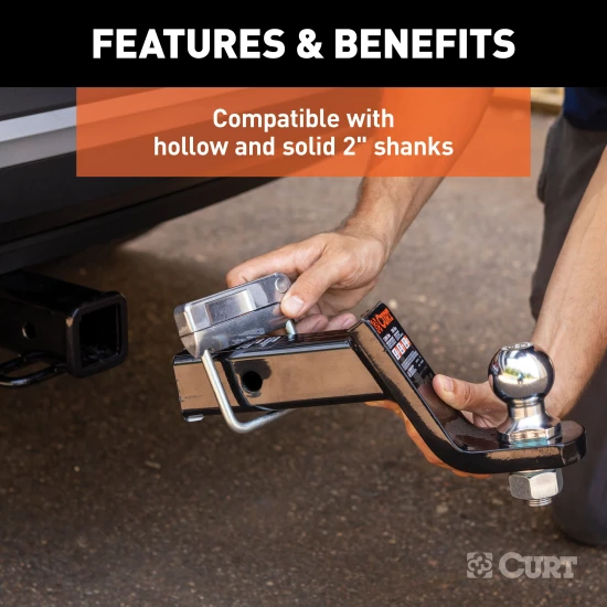 CURT anti-rattle hitch clamp installed on a 2-inch receiver hitch, preventing noise and vibration