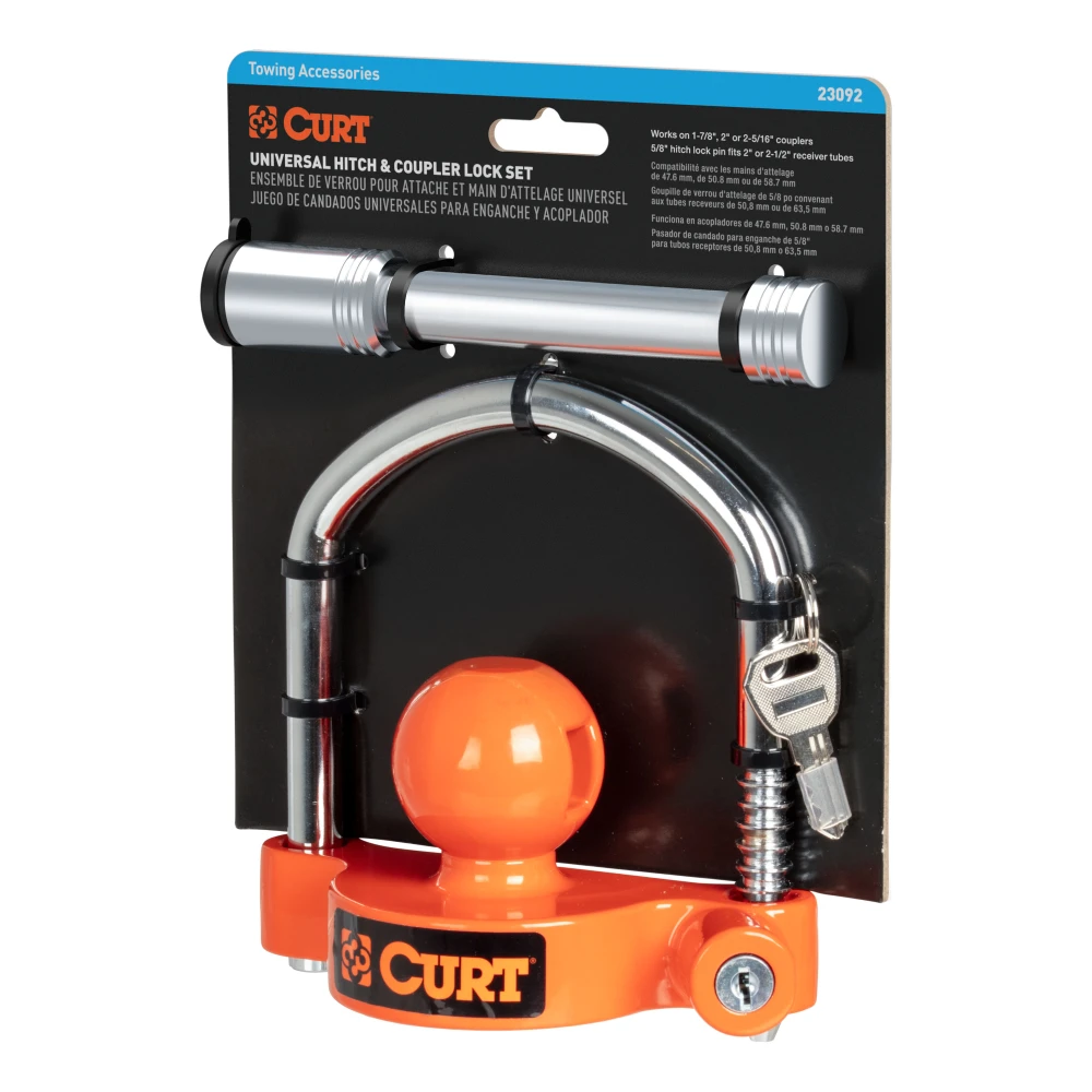 CURT hitch and coupler lock set in bright orange, showcasing universal compatibility and theft-deterrent features.