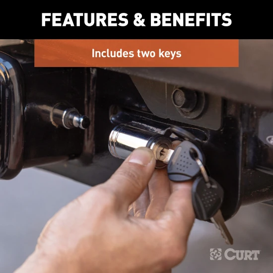 CURT hitch lock with a chrome finish and barbell design, secured with a key