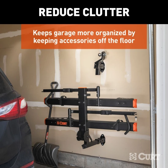 CURT wall mount organizing hitch accessories in a garage