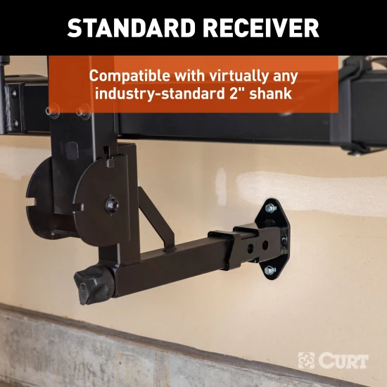 CURT wall mount organizing hitch accessories in a garage