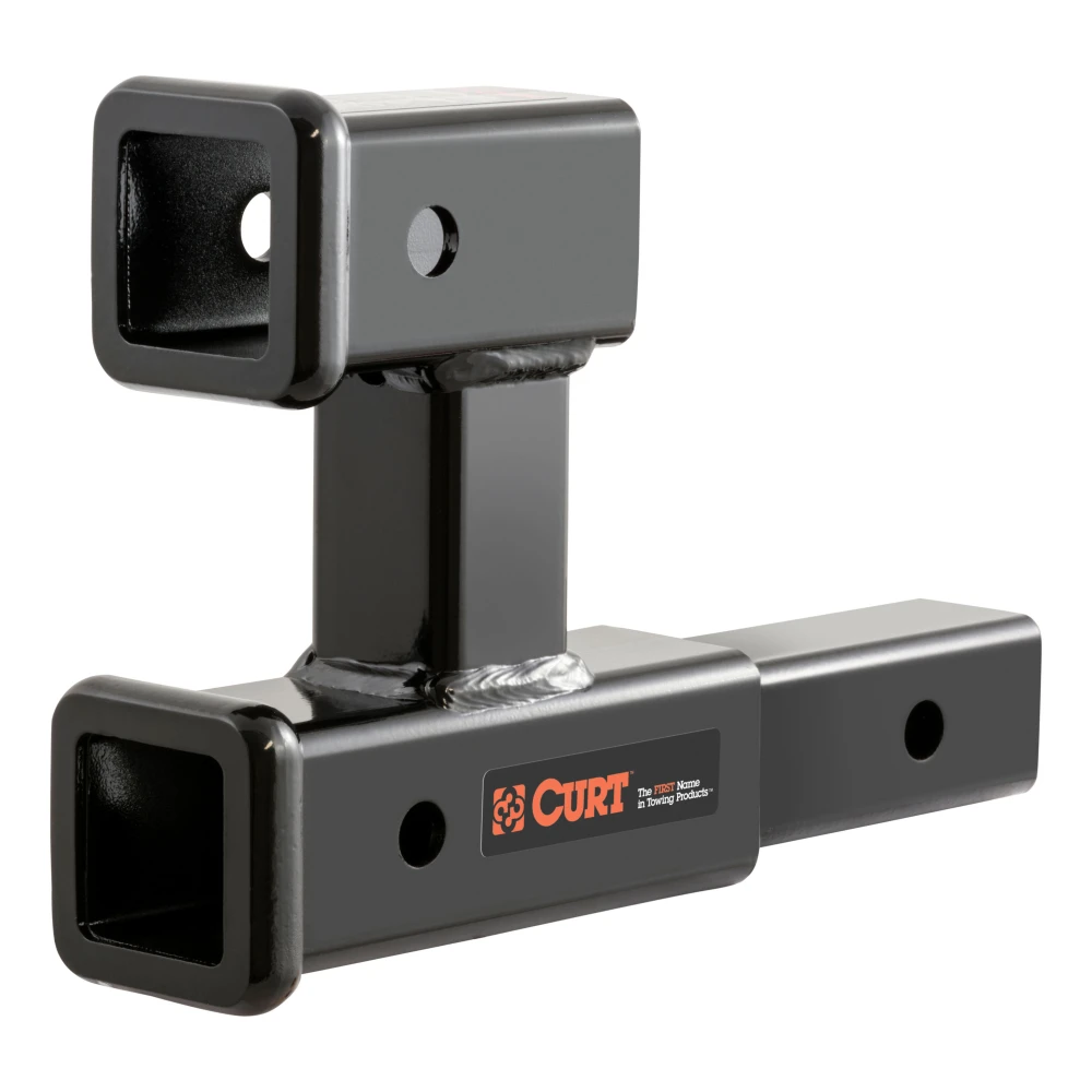 CURT dual hitch extender adds clearance and allows simultaneous towing and accessory mounting in a 2 inch receiver.