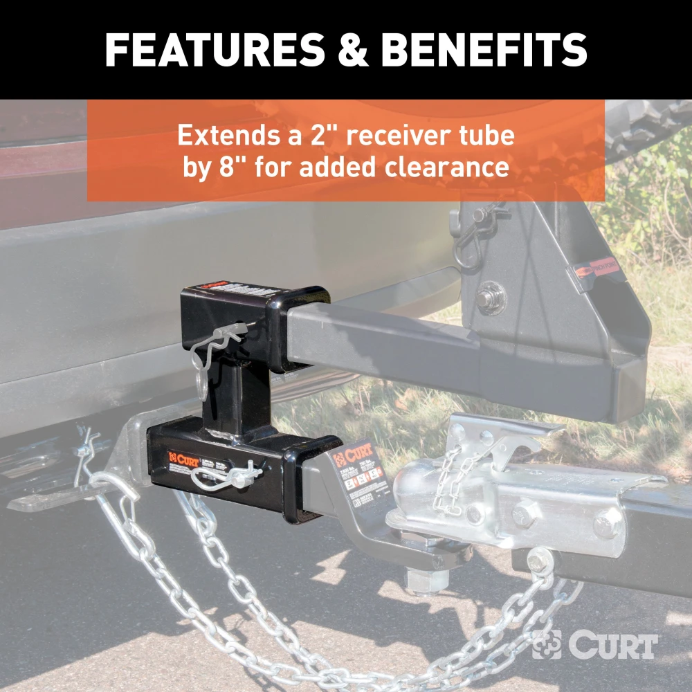 CURT dual hitch extender adds clearance and allows simultaneous towing and accessory mounting in a 2 inch receiver.