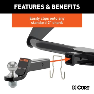 CURT safety chain hanger bracket clipped onto a 2-inch hitch shank, keeping trailer chains off the ground with durable steel construction.