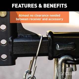 CURT safety chain hanger bracket clipped onto a 2-inch hitch shank, keeping trailer chains off the ground with durable steel construction.