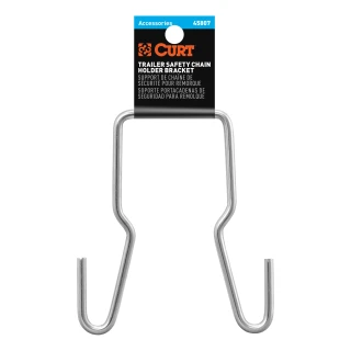 CURT safety chain hanger bracket clipped onto a 2-inch hitch shank, keeping trailer chains off the ground with durable steel construction.