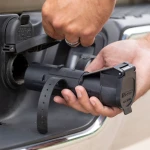 CURT Echo mobile trailer brake controller connected to a smartphone for wireless control