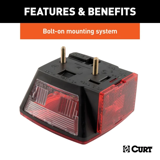 Driver-side CURT trailer taillight featuring molded housing and red lenses, including license plate illuminator and extra connections.