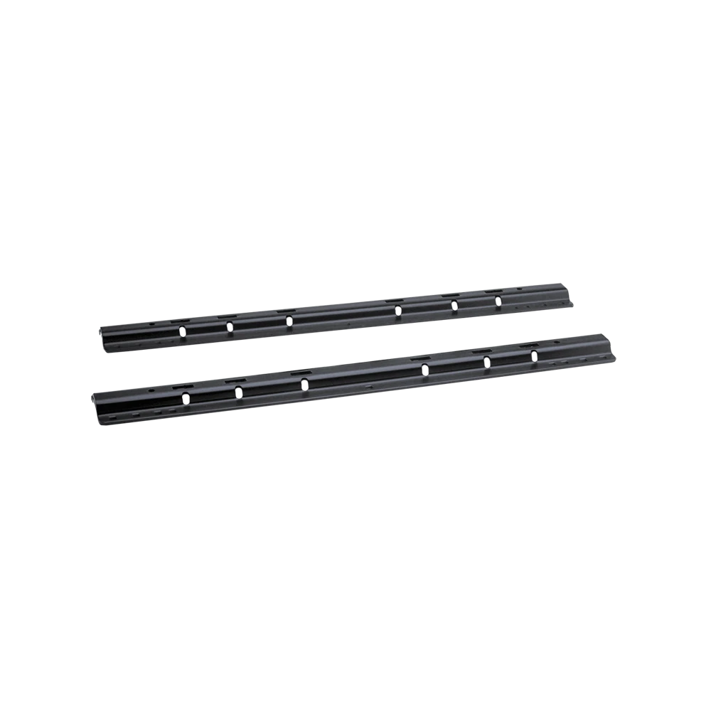 Black REESE mounting rails installed in the bed of a pickup truck for fifth wheel hitch towing.