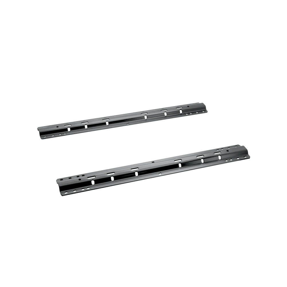 Black REESE mounting rails installed in the bed of a pickup truck for fifth wheel hitch towing.